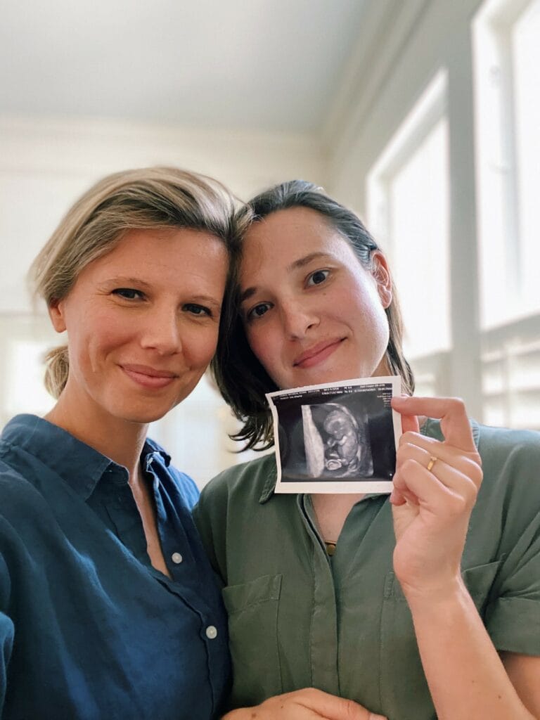 Two women with ultrasound photo
