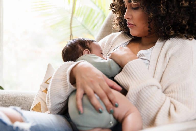 Photo of woman breastfeeding baby