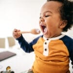 Toddler happily eating photo