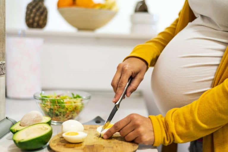 Photo of pregnant mom eating egg